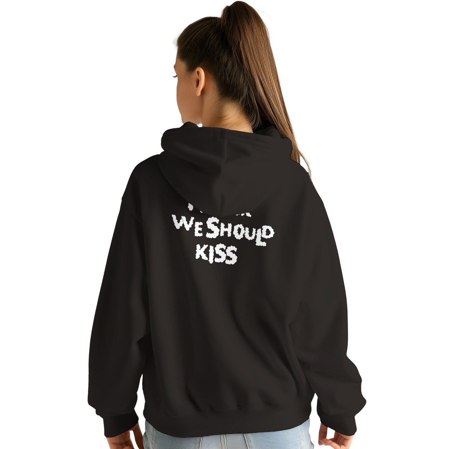 Back view of a black hoodie worn by a female model, featuring black handwritten-style text that reads "I think we should kiss." A cozy and playful design perfect for casual and romantic vibes.