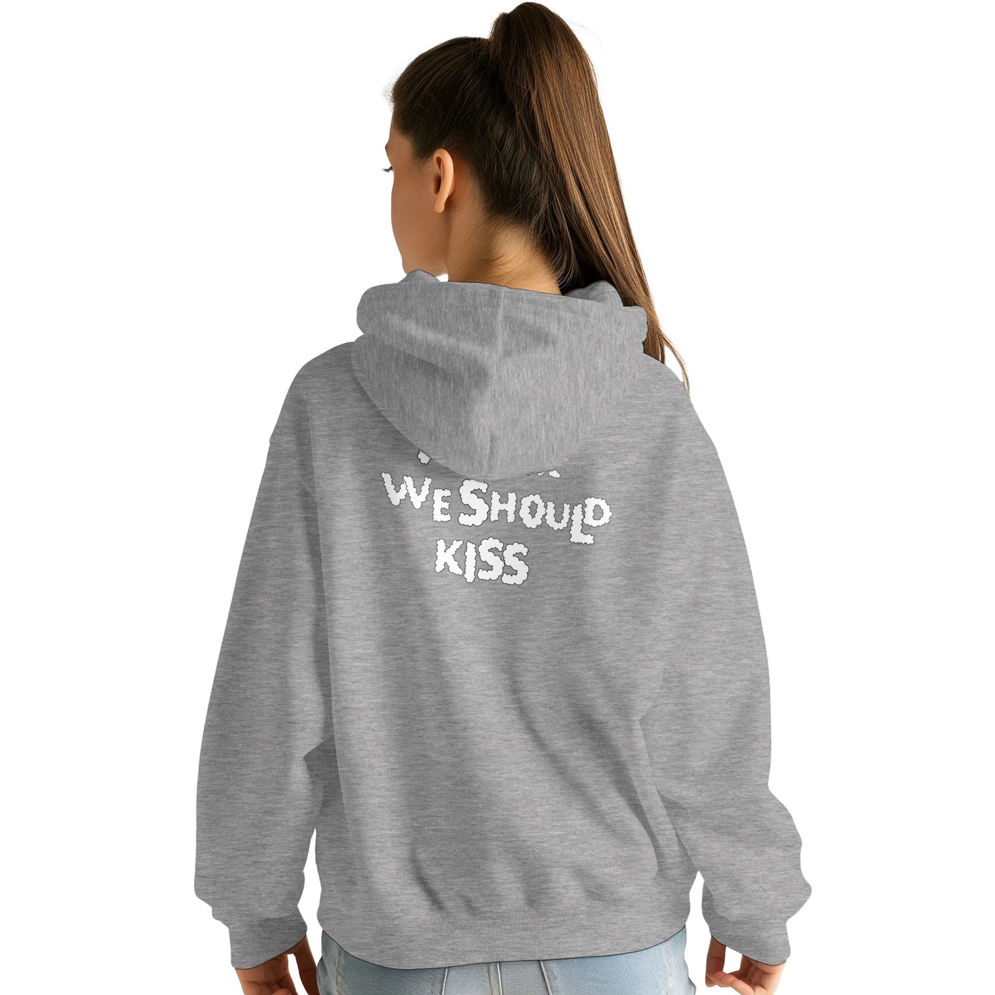 Back view of a heather grey hoodie worn by a female model, featuring black handwritten-style text that reads "I think we should kiss." A cozy and playful design perfect for casual and romantic vibes.