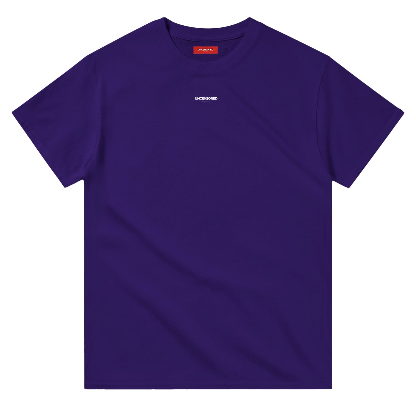 Flat-lay of a deep purple T-shirt with a minimalist "UNCENSORED" logo printed on the chest. The T-shirt features a classic crewneck and a red interior label for branding.