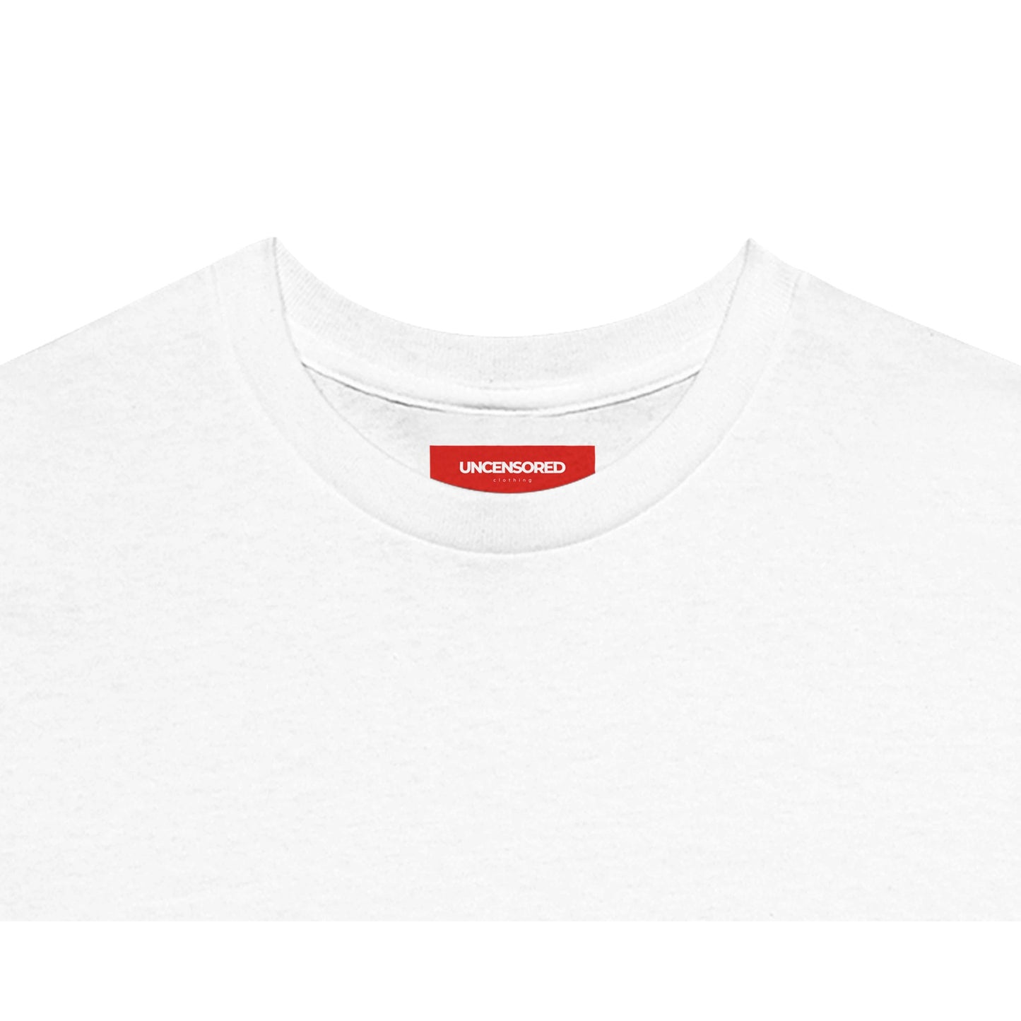 Close-up of the neckline of a white T-shirt, featuring a red label with the "UNCENSORED" Clothing branding. Soft fabric with a clean and minimalistic finish.
