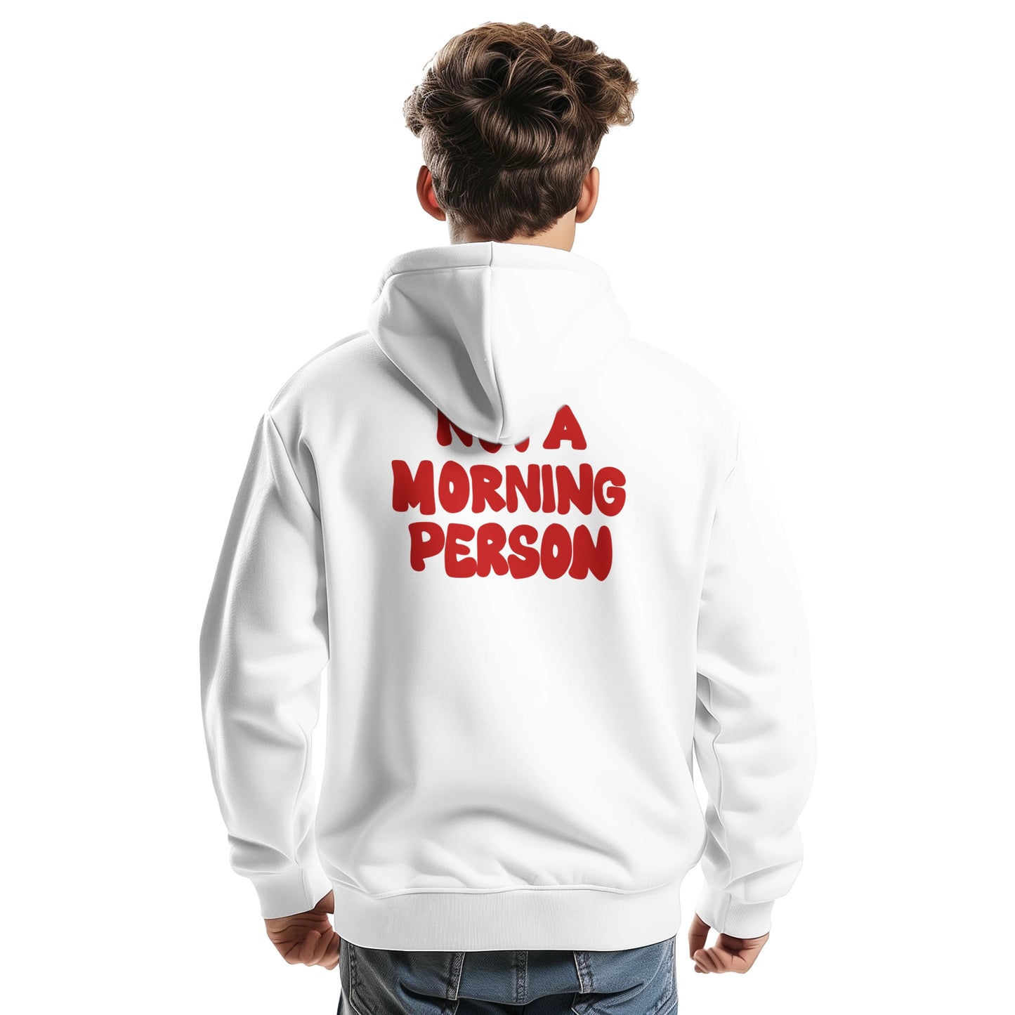 A young man wearing a white hoodie, shown from the back. The hoodie features bold red text saying "NOT A MORNING PERSON". The hoodie has a relaxed fit, and the model is casually posing with one hand slightly clenched.