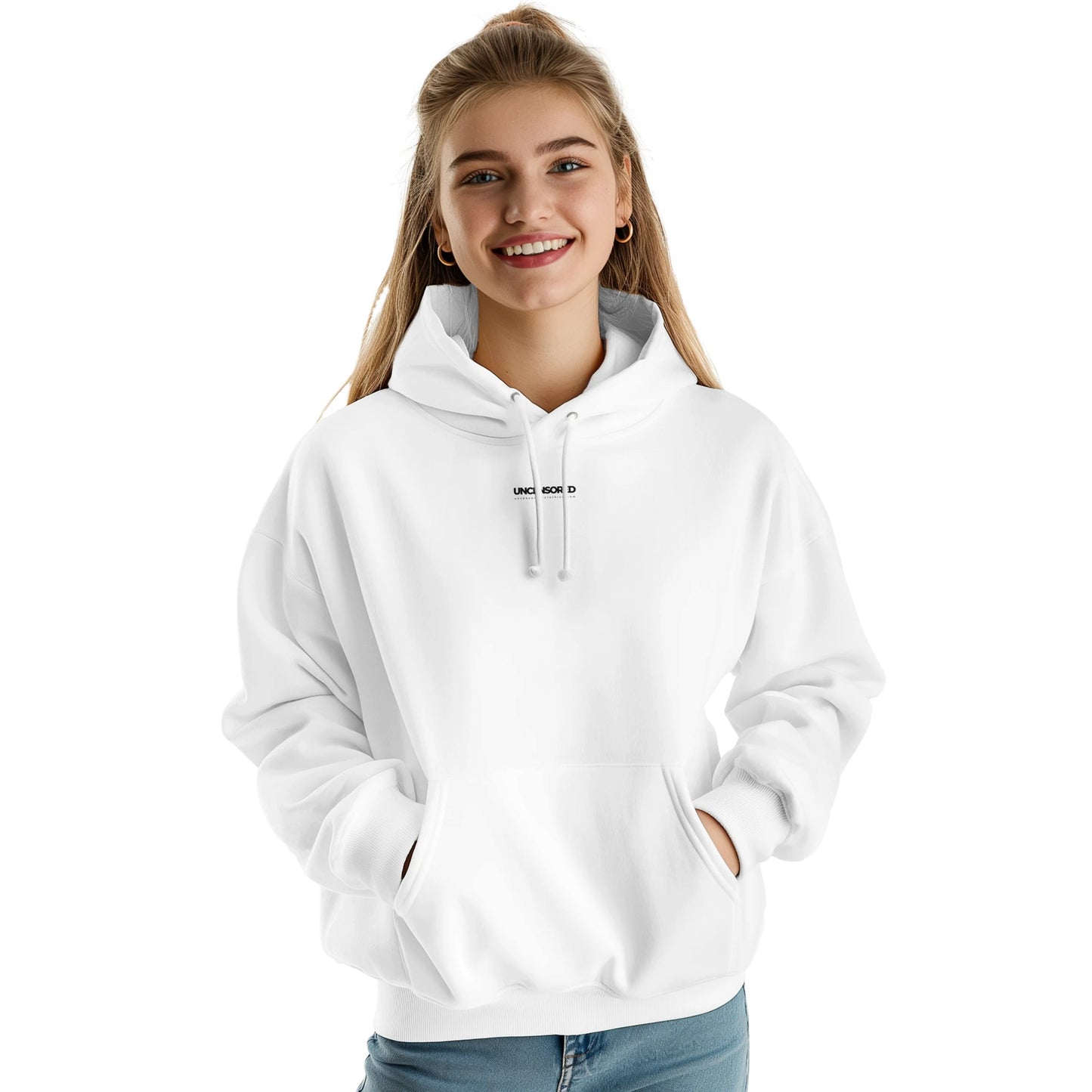 A woman wearing a white hoodie with a small black "UNCENSORED" logo centered on the upper chest. The hoodie has a relaxed fit, a front kangaroo pocket, and an adjustable drawstring hood. She is smiling and standing against a plain white background.