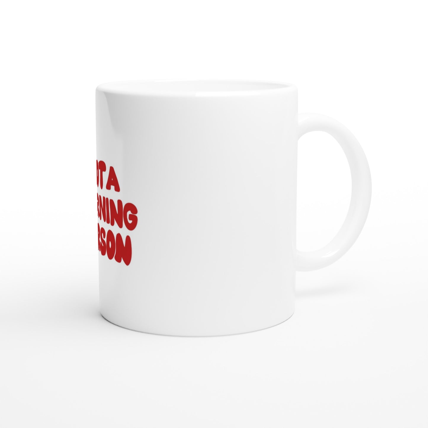 White ceramic coffee mug with "NOT A MORNING PERSON" text slightly visible on the side. Minimalist design with a large, comfortable handle for easy grip.