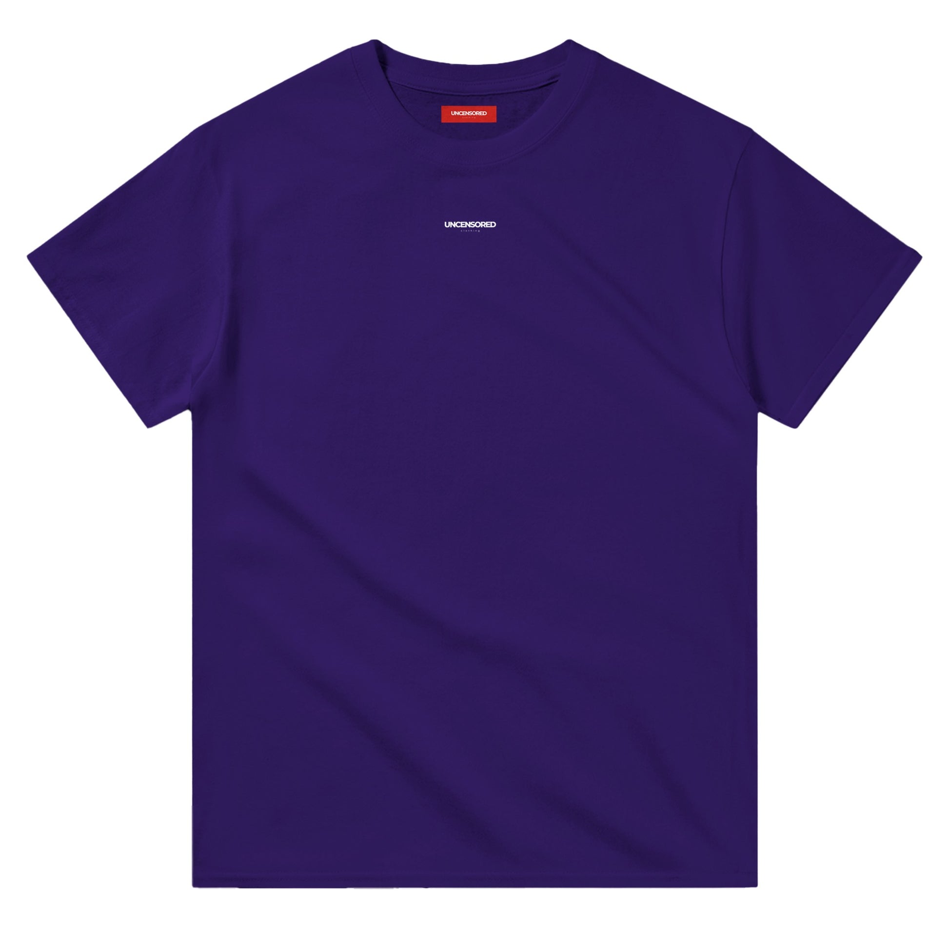 Flat-lay of a deep purple T-shirt with a minimalist "UNCENSORED" logo printed on the chest. The T-shirt features a classic crewneck and a red interior label for branding.