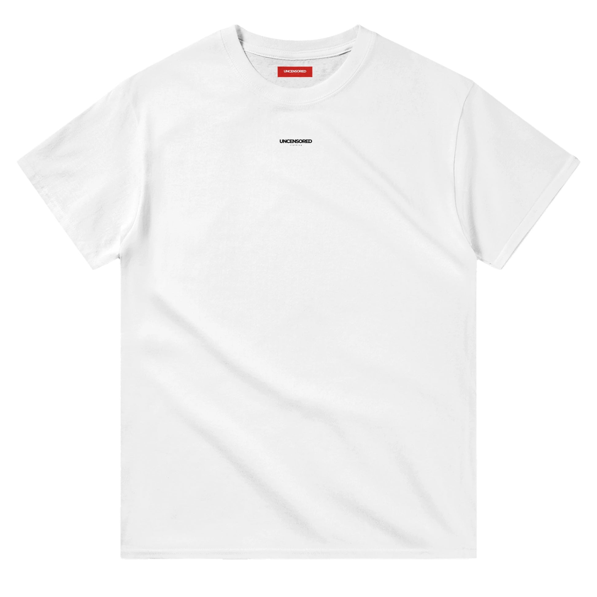Flat-lay of a white T-shirt with a minimalist "UNCENSORED" logo printed on the chest. The T-shirt features a classic crewneck and a red interior label for branding.