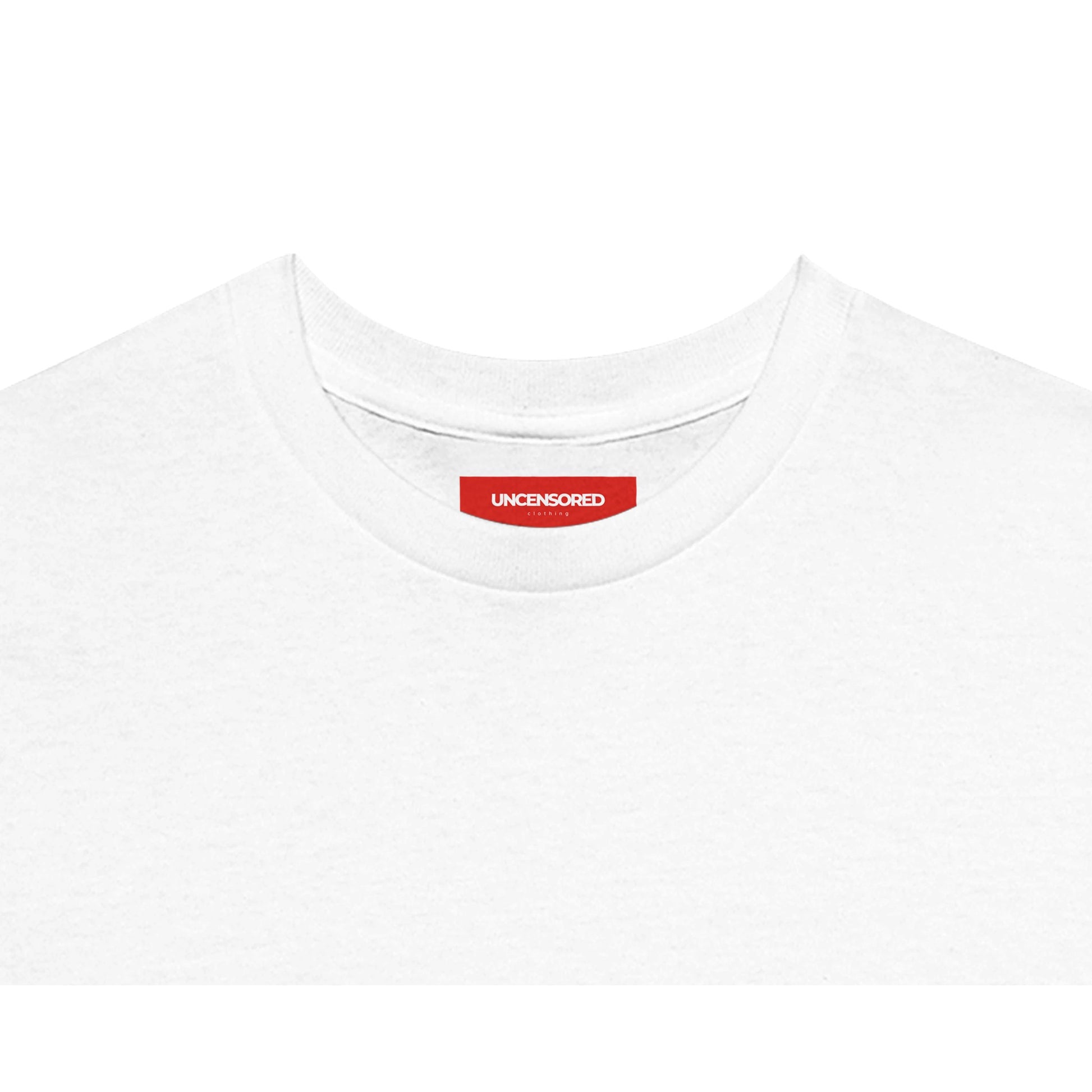Close-up of the neckline of a white T-shirt, featuring a red label with the "UNCENSORED" Clothing branding. Soft fabric with a clean and minimalistic finish.
